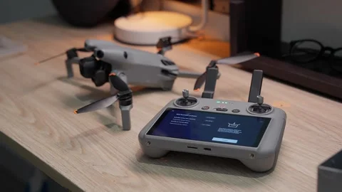 Updating DJI Mini 5 Pro firmware at studio workspace on September 5 2026 스톡 동영상 344619465