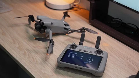 Updating DJI Mini 5 Pro firmware at studio workspace on September 5 2026 스톡 동영상 344619466