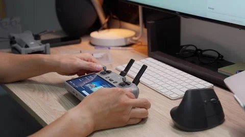 Updating DJI Mini 5 Pro firmware at studio workspace on September 5 2026 스톡 동영상 344687632