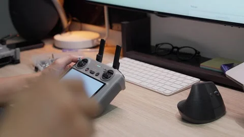 Updating DJI Mini 5 Pro firmware at studio workspace on September 5 2026 스톡 동영상 344687633