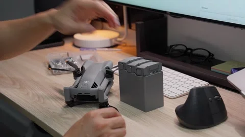 Updating DJI Mini 5 Pro firmware at studio workspace on September 5 2026 스톡 동영상 344687637