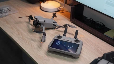 Updating DJI Mini 5 Pro firmware at Ho Chi Minh City studio on September 5 2026 Stock Footage 345630402