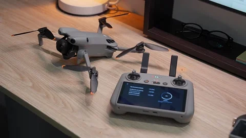 Updating DJI Mini 5 Pro firmware at Ho Chi Minh City studio on September 5 2026 Stock Footage 345630497