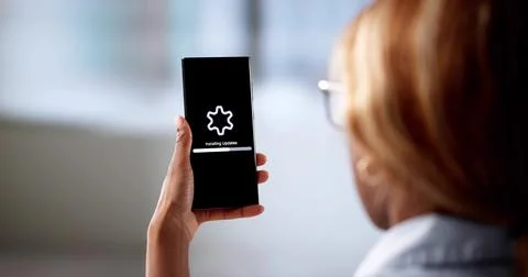 Updating Phone Software, A Young Tech Woman In A Circle. Stock Photos