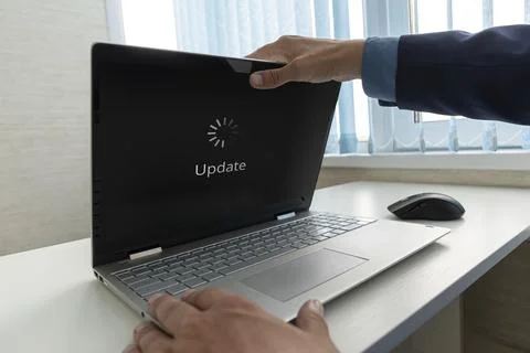 Updating Software Technology Upgrade Concept. a businessman opens a modern ul 스톡 사진