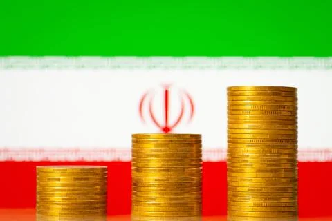 Upgoing graph made of coins stacked in front of Iran flag Stock Photos