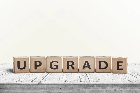 Upgrade sign made with wooden blocks Stock Photos