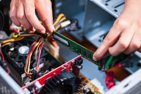 Upgrading computer hardware ram installation in a tech workshop close-up vi.. Stock Photos