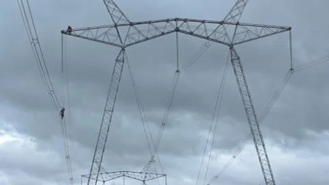 Upgrading the Grid: High-Flying Electrical Maintenance Stock Footage 263539612