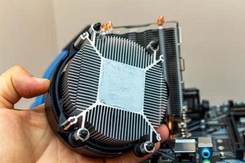 Upgrading installing more powerful cooler on a personal computer processor. T Stock Photos