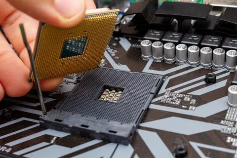Upgrading installing more powerful CPU on a personal computer. The process co Stock Photos