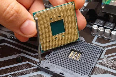 Upgrading installing more powerful CPU on a personal computer. The process co Stock Photos