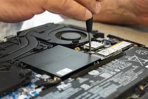 Upgrading SSD Drive Inside a Modern Laptop Stock Photos