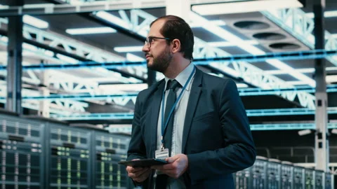 Upgrading systems, tablet and software developer in data center Stock Footage 329721037