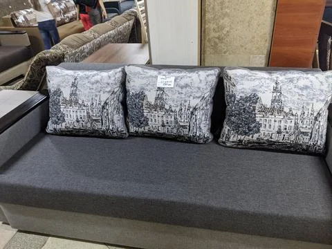 Upholstered sofas and armchairs in the store. Stock Photos