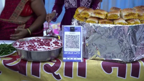 UPI QR code scanner at fast food street vendors Stock Footage 302359779