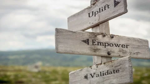 Uplift empower validate text engraved on wooden signpost outdoors in nature. Stock Footage 170629845