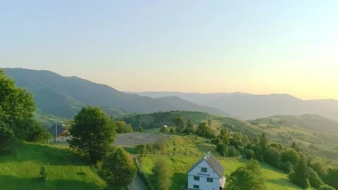 Uplifting above nice green valley with cozy houses Stock Footage 321018228
