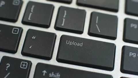 Upload button on computer keyboard, female hand fingers press key Stock Footage 97827933