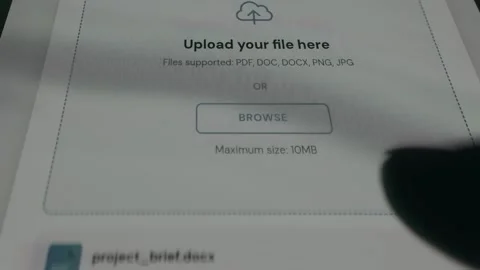 Upload interface for a file, person taps the BROWSE option Stock Footage 333834140