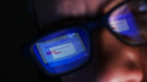Uploading spyware reflected in man's glasses Video stock 61705381