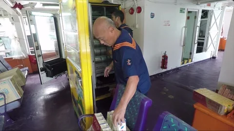 Uploading the vending machine, inside ferry boat, Hong Kong Stock Footage 153039684