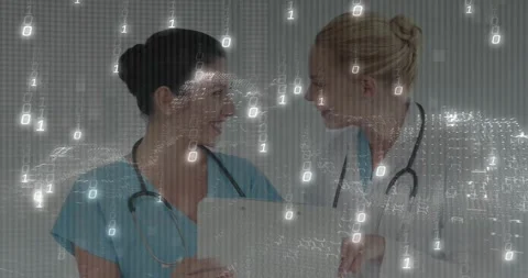 Upon binary code streaming nurse holding tablet physician leaning in and Stock Footage 319682066