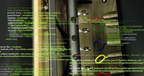 Upon opening drawer rails holding colored coils, clips meeting scrolling code Stock Footage 317835192