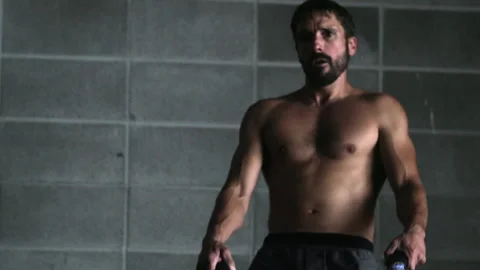 Upper body workout routine with ropes by man in gym for fitness training Stock Footage 312767793