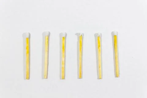 Upper close-up shot of orderly positioned multiple white match head covered m Foto stock