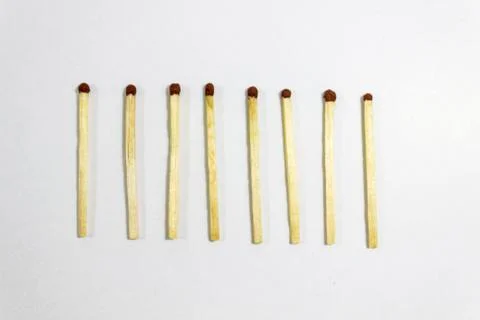 Upper close-up shot of orderly positioned multiple black match head covered m Foto stock