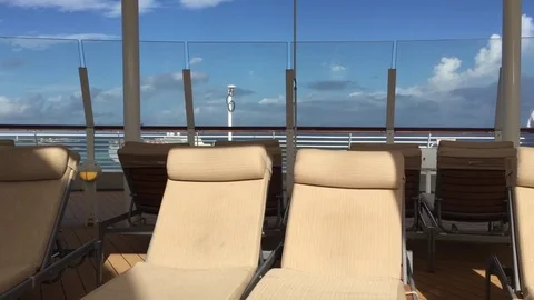 Upper deck cruise ship poolside 2 lounge chairs Stock Footage 71130952