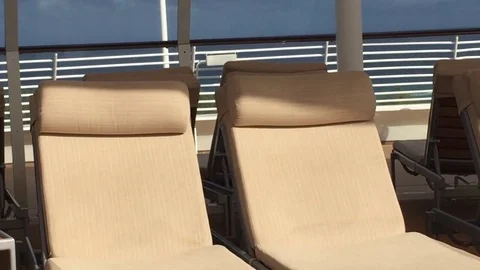 Upper deck cruise ship poolside 2 lounge chairs Stock Footage 71130988