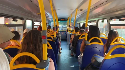 Upper deck of a London double-decker bus with passengers seated Video stock 321460291