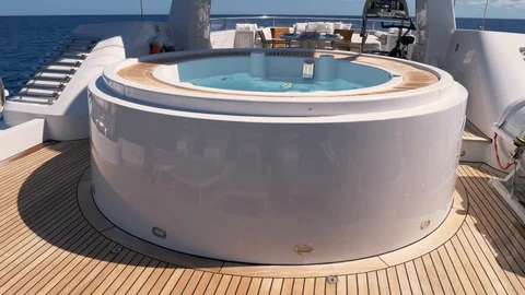 Upper deck of mega yacht with a hot tub and communications tower  Stock Footage 111653945