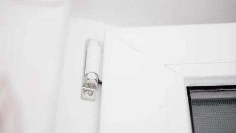 Upper door hinge of a plastic door close-up. Frequent door opening and closing Stock Footage 244438615
