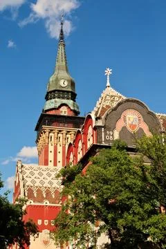 Upper facade and clock tower of the city hall, town hall on a sunny day, an.. Stock Photos