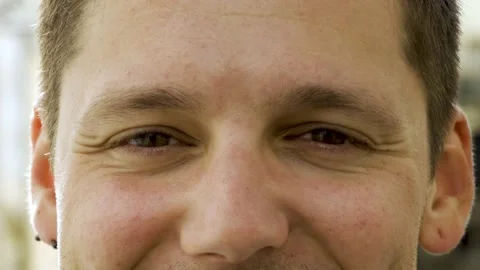 Upper face of young Caucasian man looking at camera Stock-Footage 132936374