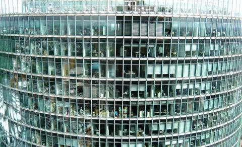 The upper floors of a multistory office building, photographed from a nearby Stock Photos