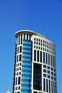 The upper floors of the skyscraper. Skyscraper against the blue sky. Stock Photos