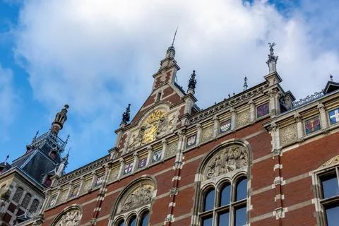 Upper front facade of Amsterdam Centraal Station Stock Photos