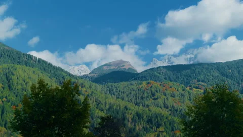 Upper Mountain Valley with Forests and Distant Rocky Peaks Stock Footage 320174171