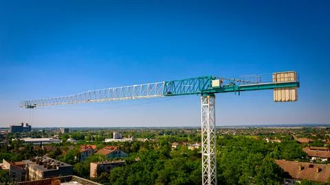 The upper part of construction tower crane with counterweights Stock Photos