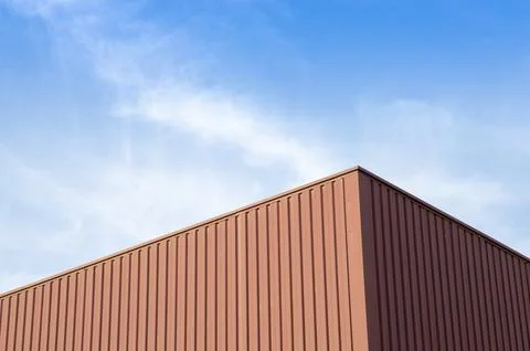 Upper part of the facade of a factory Stock Photos