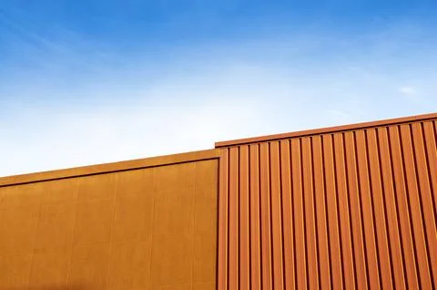 Upper part of the facade of a factory Stock Photos
