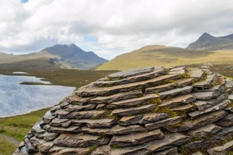 Upper part of The Globe  by Joe Smith close to hiking trail at Knockan Crag i Stock Photos