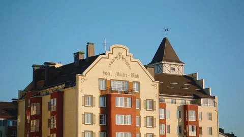 Upper part of interesting red-yellow house-hotel of European style Stock Footage 118064576