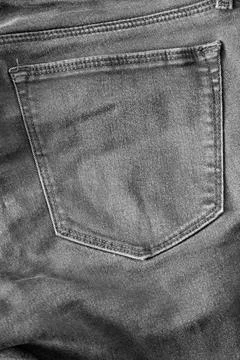 The upper part of old worn black jeans with pockets Stock Photos