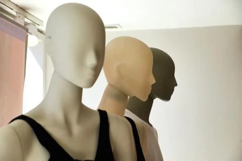 The upper part of the three female dummies under artificial lighting. Shallow Stock Photos