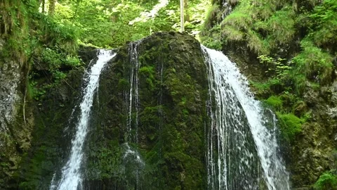 The upper part of a twofold waterfall in a forest (slow motion) Stock-Footage 262076216